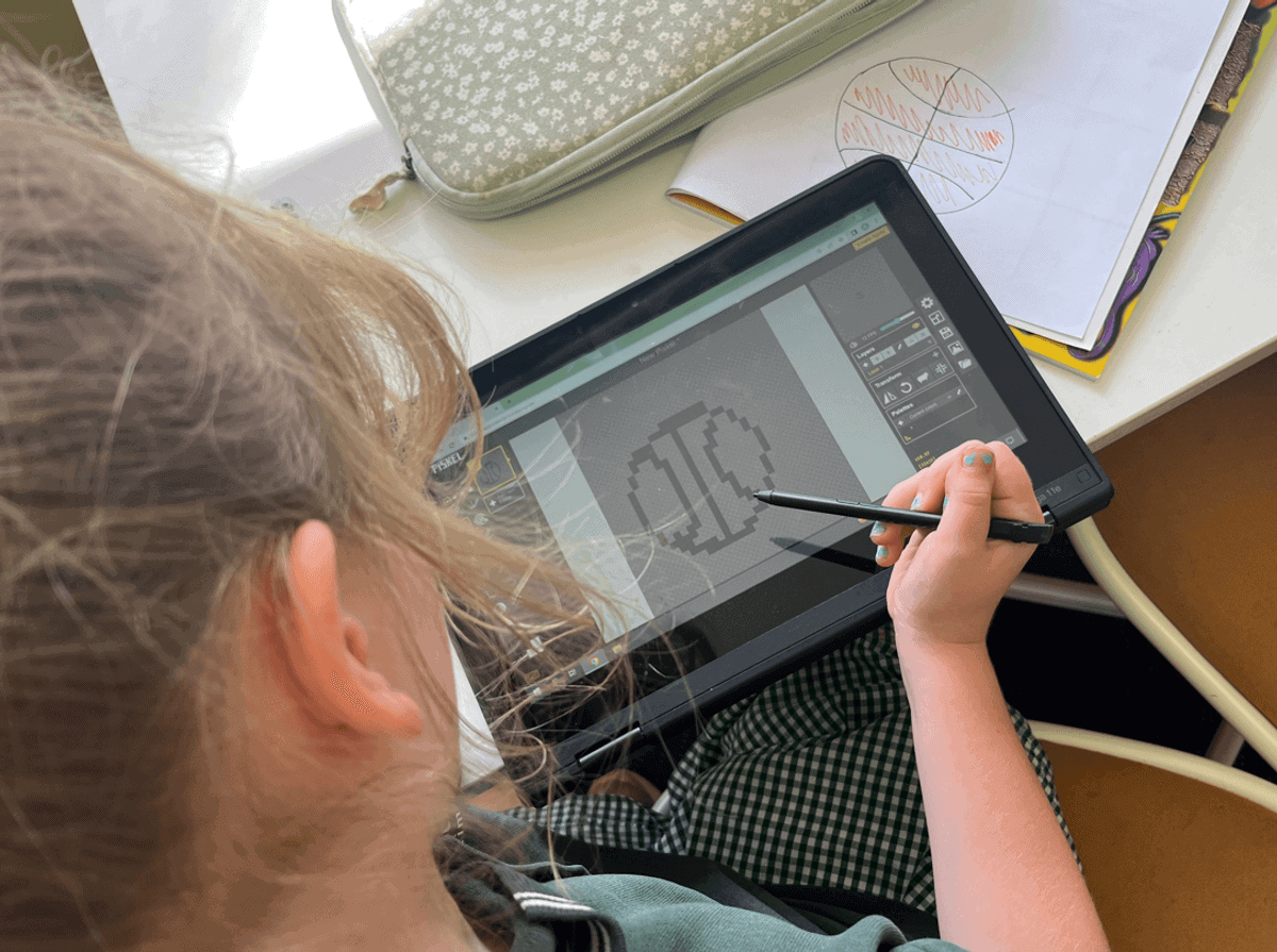 A girl drawing on a tablet computer.